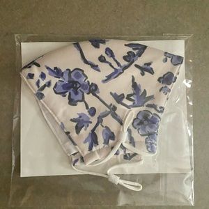 White and blue floral Tory Burch mask